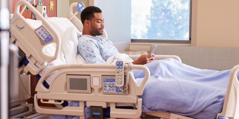 Image of a man on a hospital bed