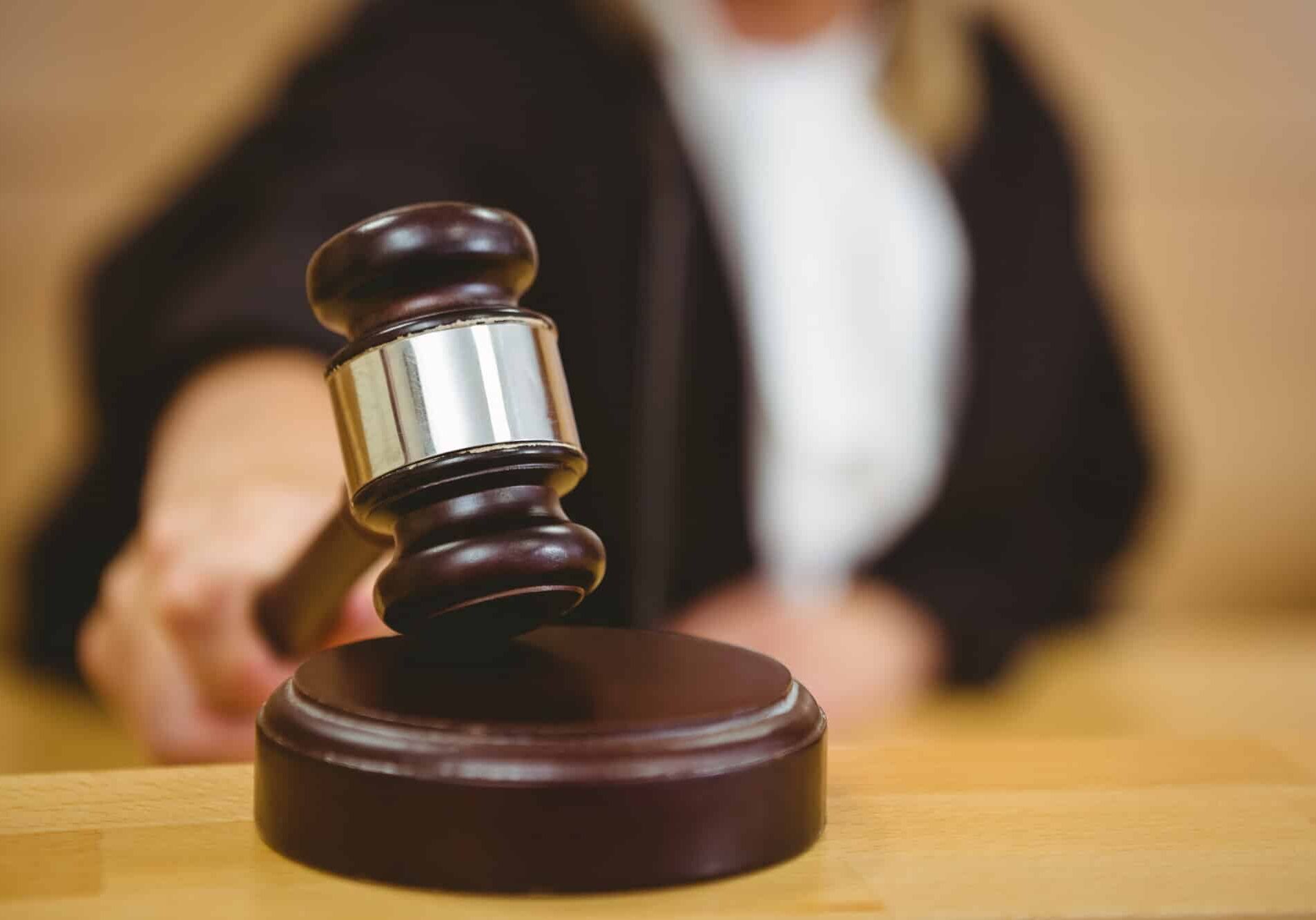 Judge using a gavel in court for a wrongful death lawsuit